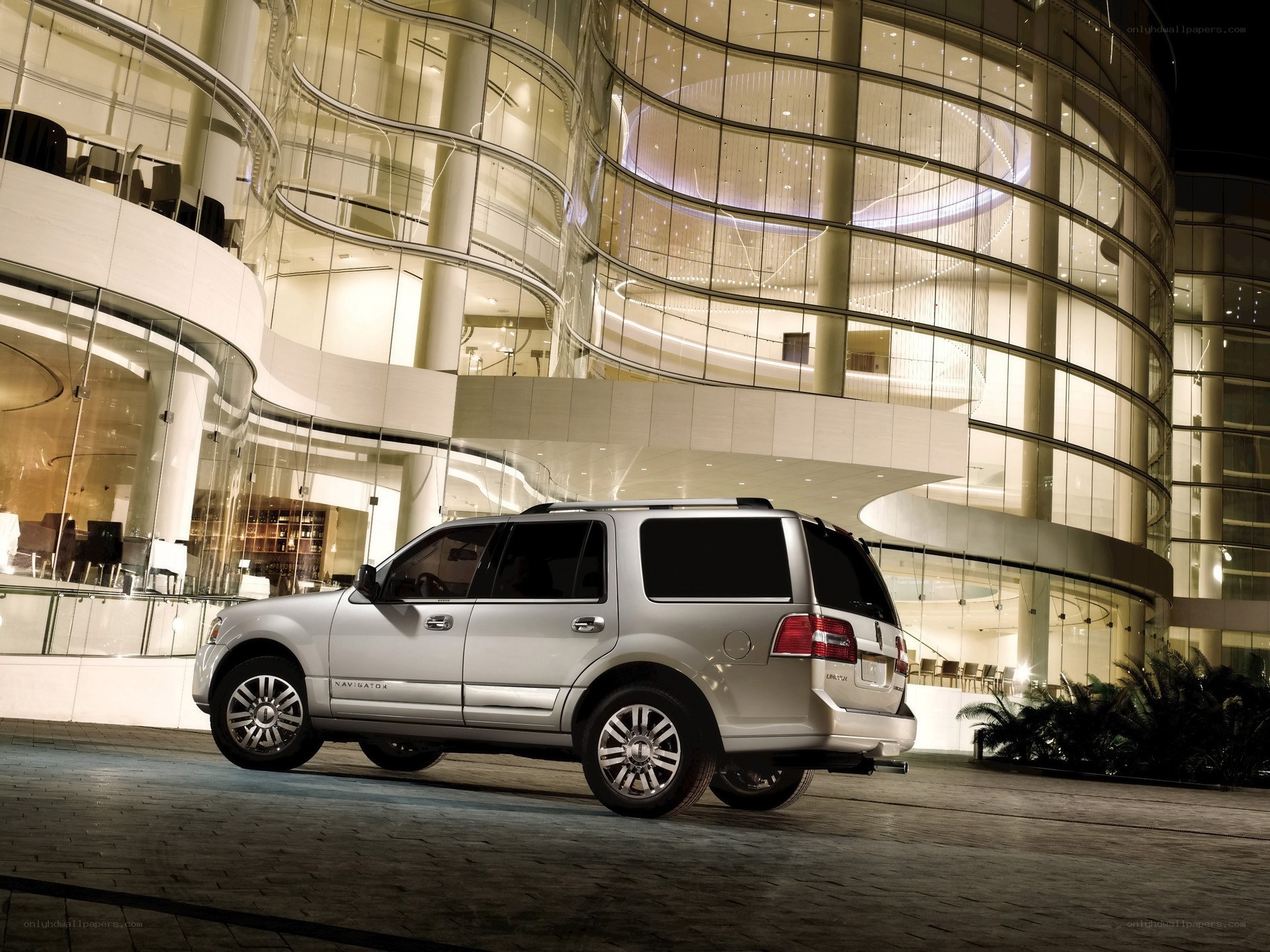 Silver SUV at modern building