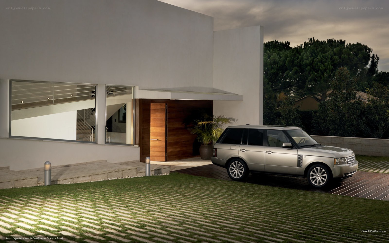 Silver SUV at modern home
