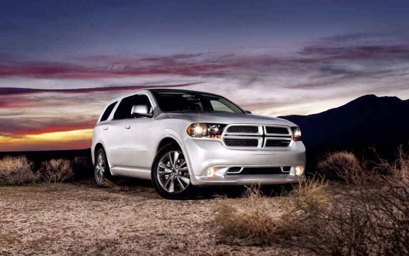 Silver SUV at sunset