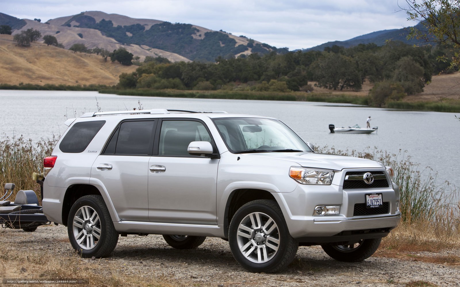 Silver SUV by a lake