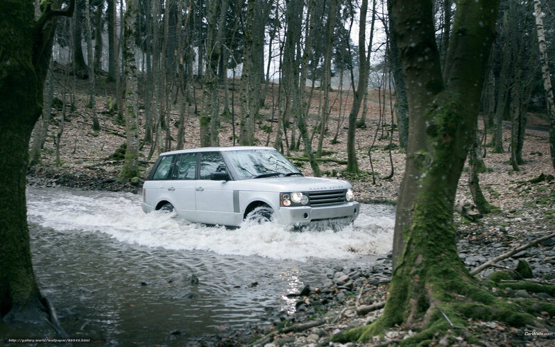 Silver SUV crossing a stream