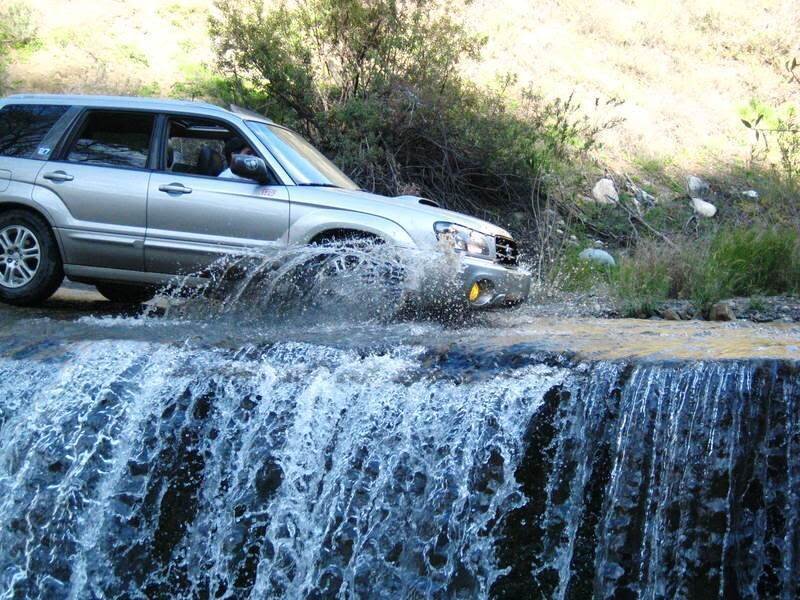 Silver Suv Crossing Stream
