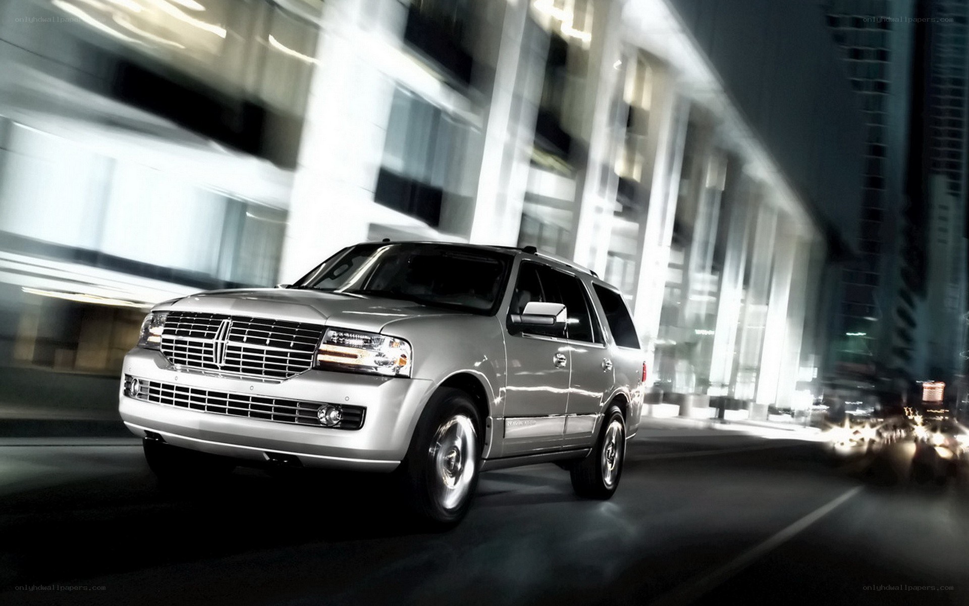 silver suv driving at night