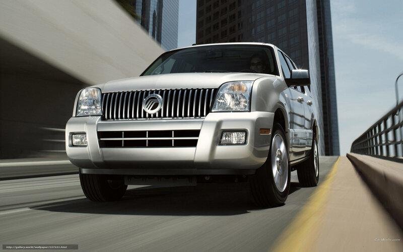 silver suv driving on bridge