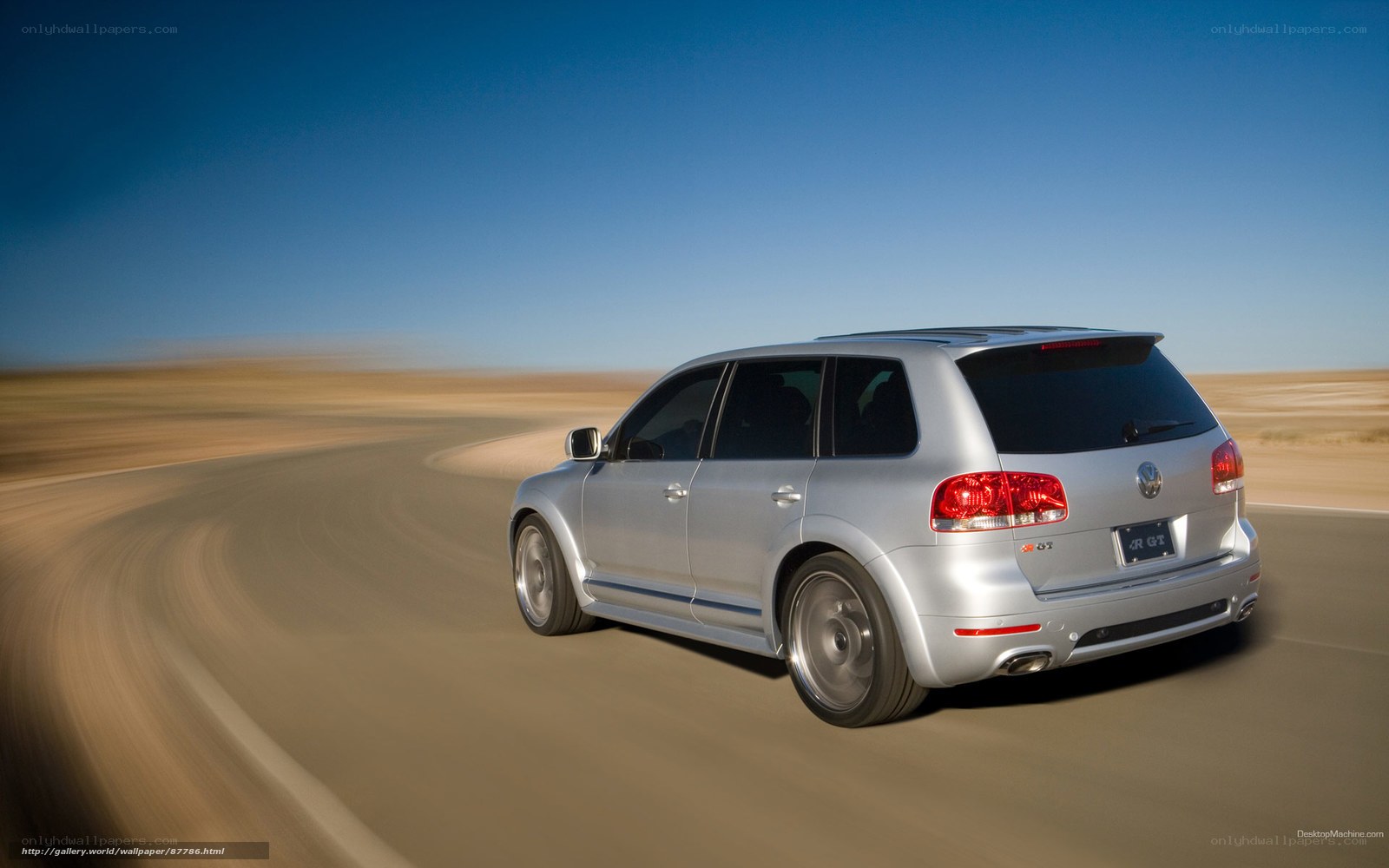 silver suv driving on desert road