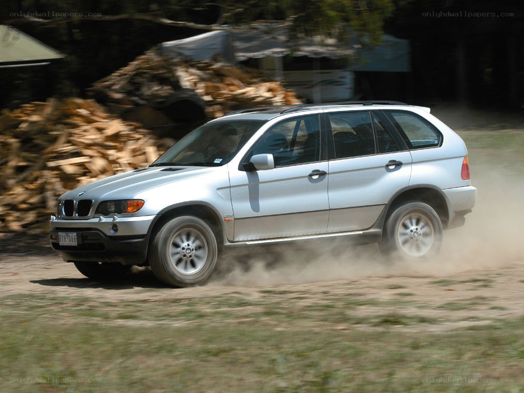 silver suv driving on dirt