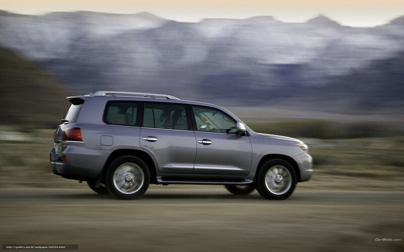 silver suv driving on dirt road