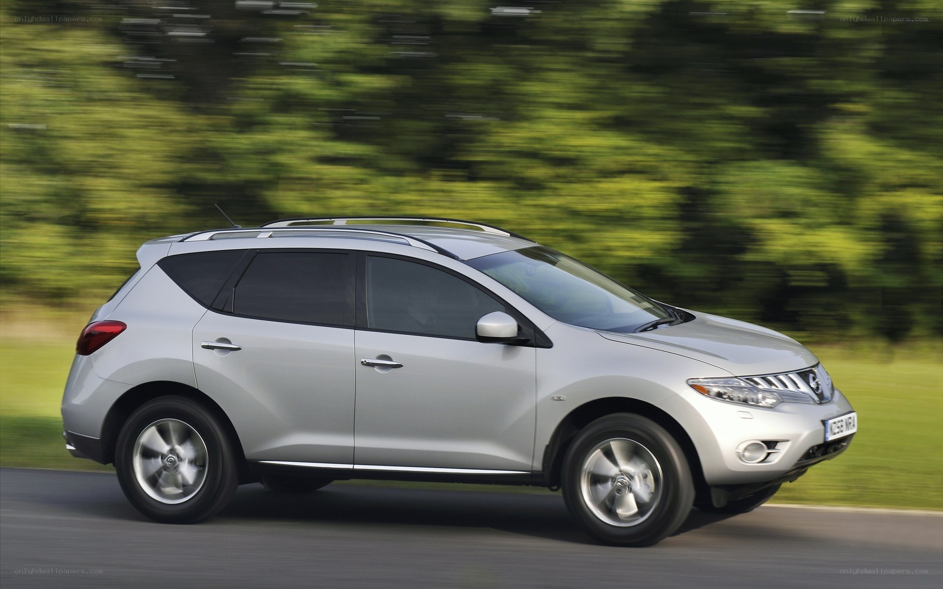 silver suv driving on road
