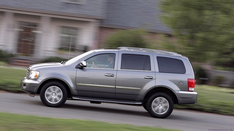 silver suv driving on road