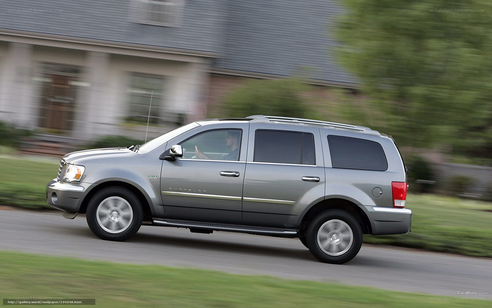 silver suv driving on road