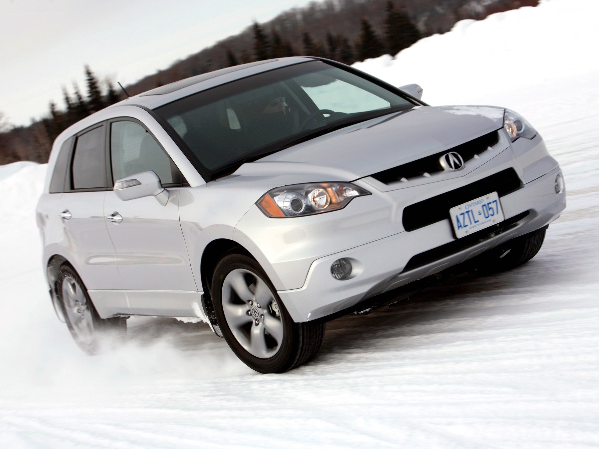 Silver SUV driving on snow