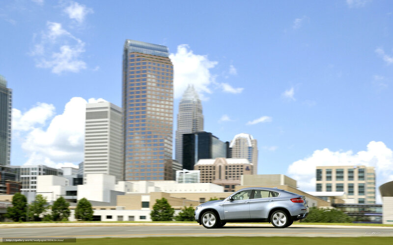 Silver SUV in cityscape