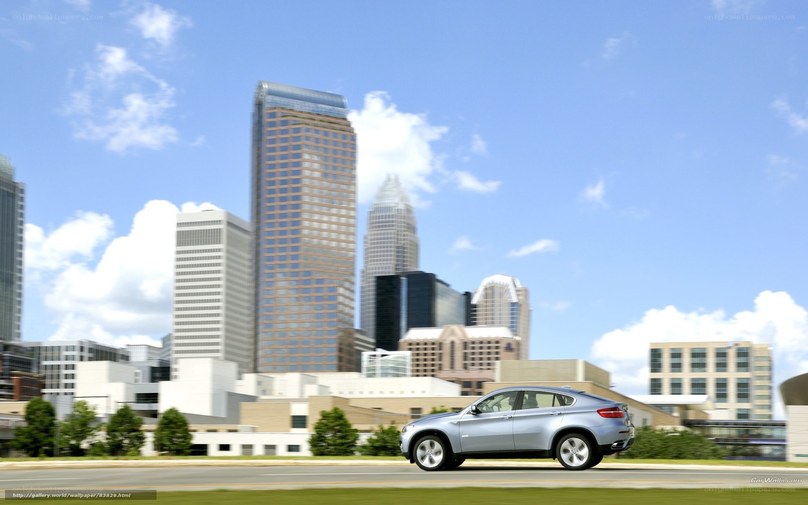 Silver SUV in cityscape