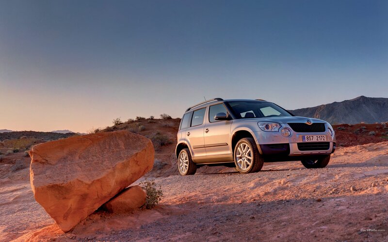 Silver SUV in desert landscape