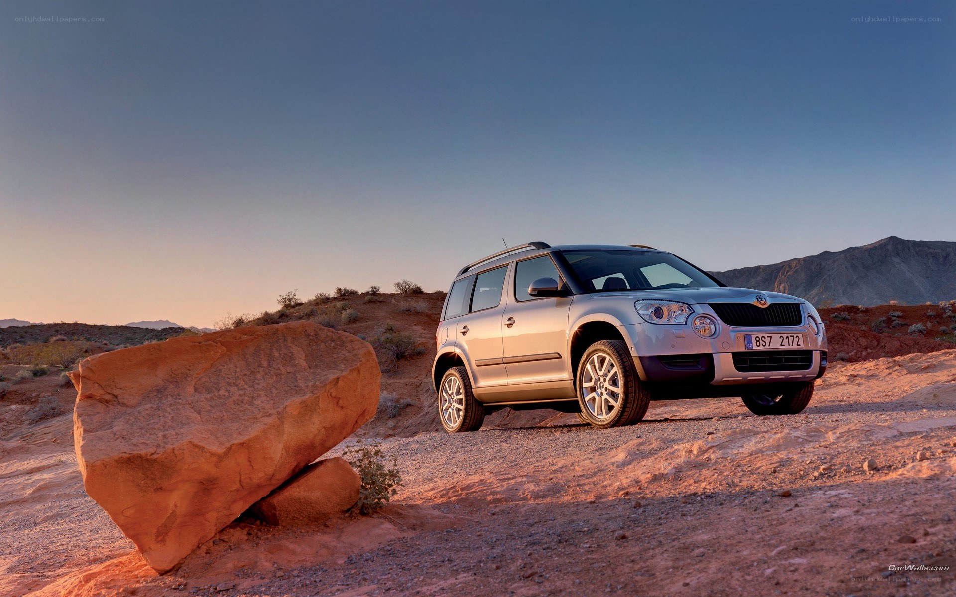 Silver SUV in desert landscape