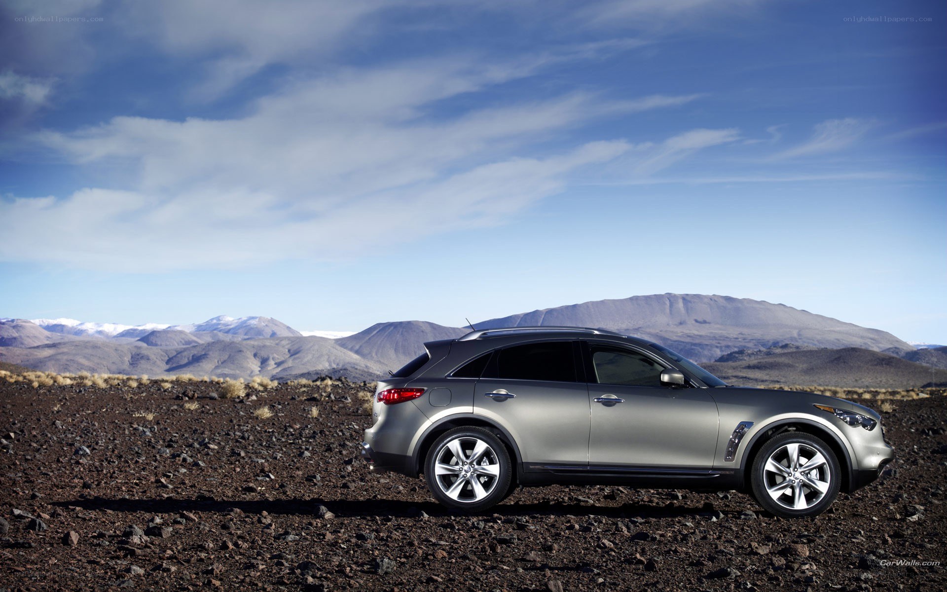 silver suv in desert landscape