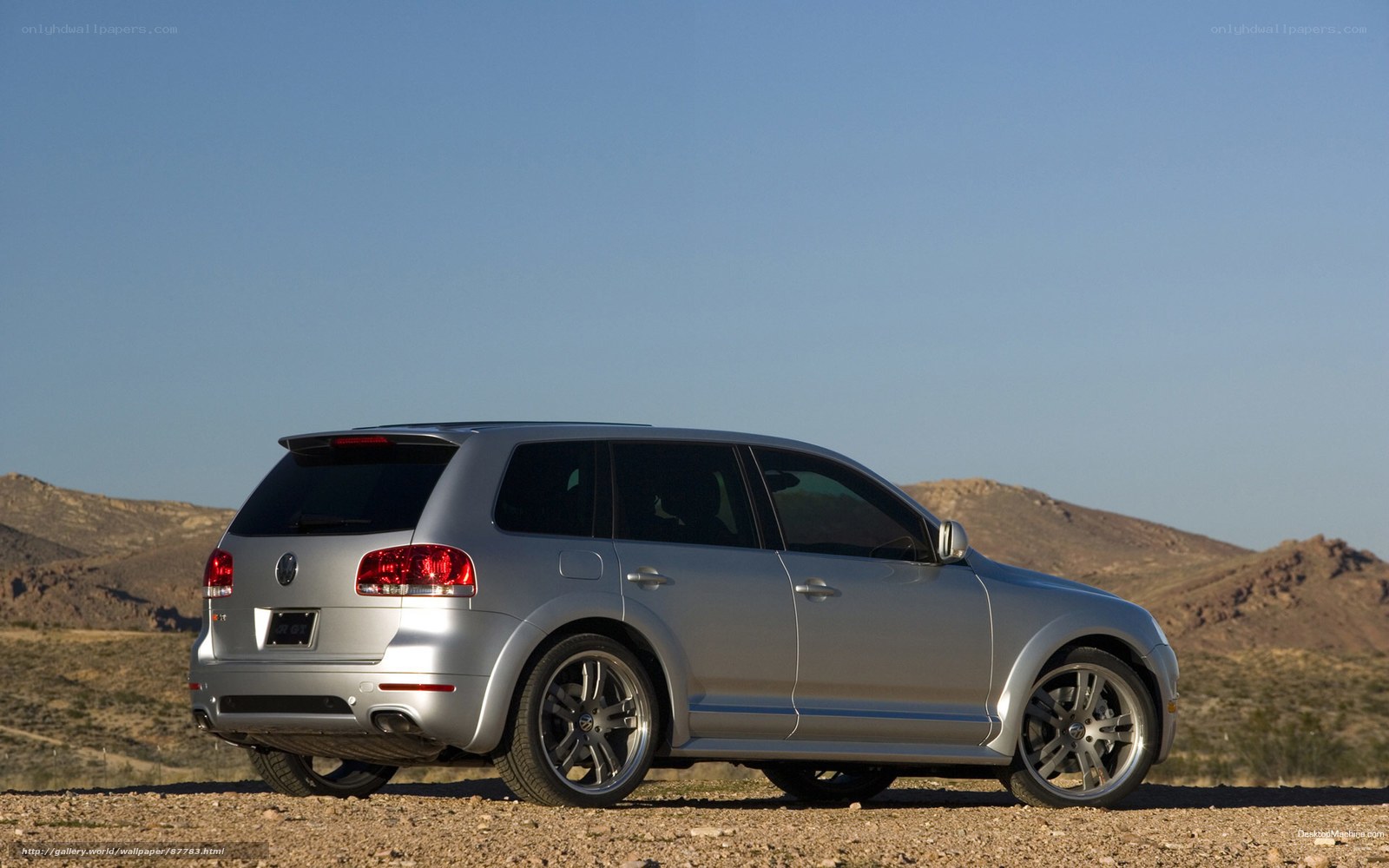 silver suv in desert landscape