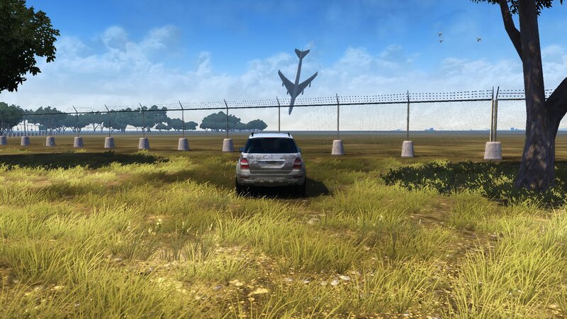 Silver SUV in Grass