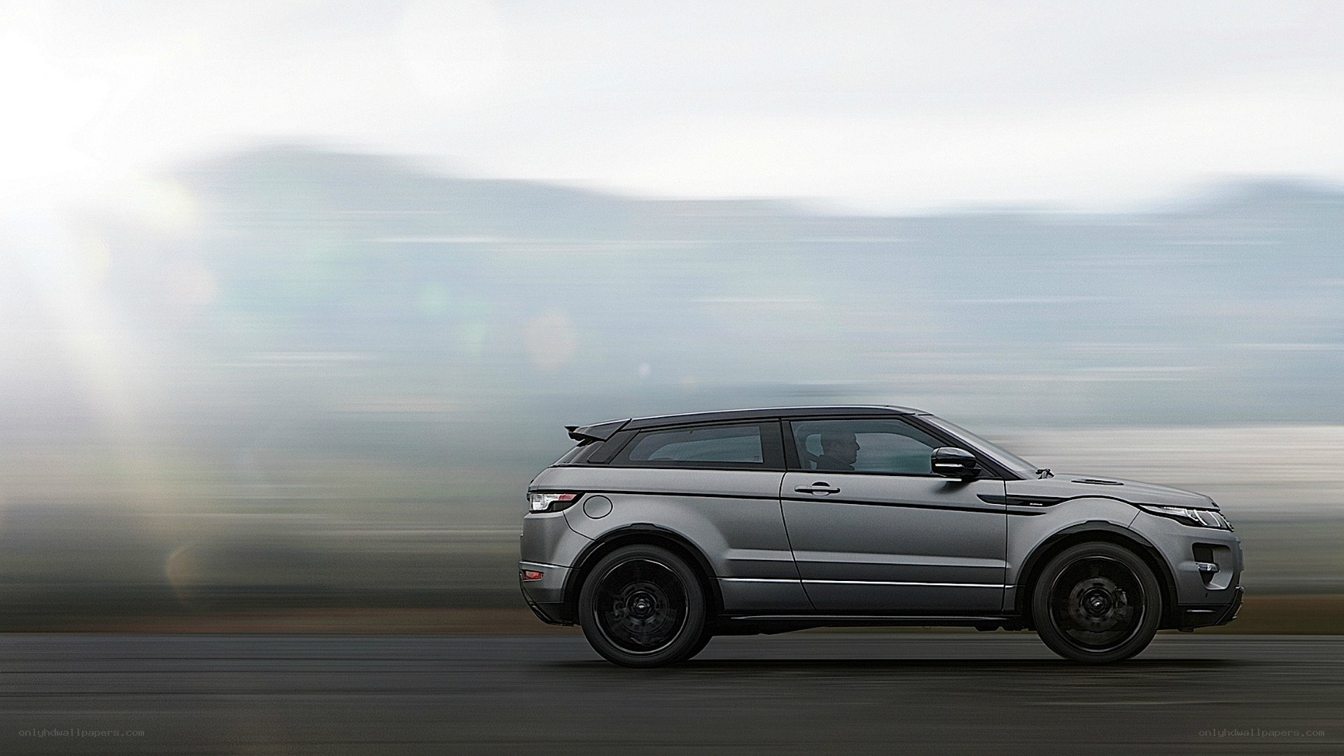 silver suv in motion