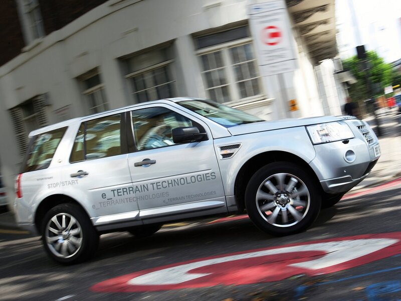 Silver SUV in motion on city street