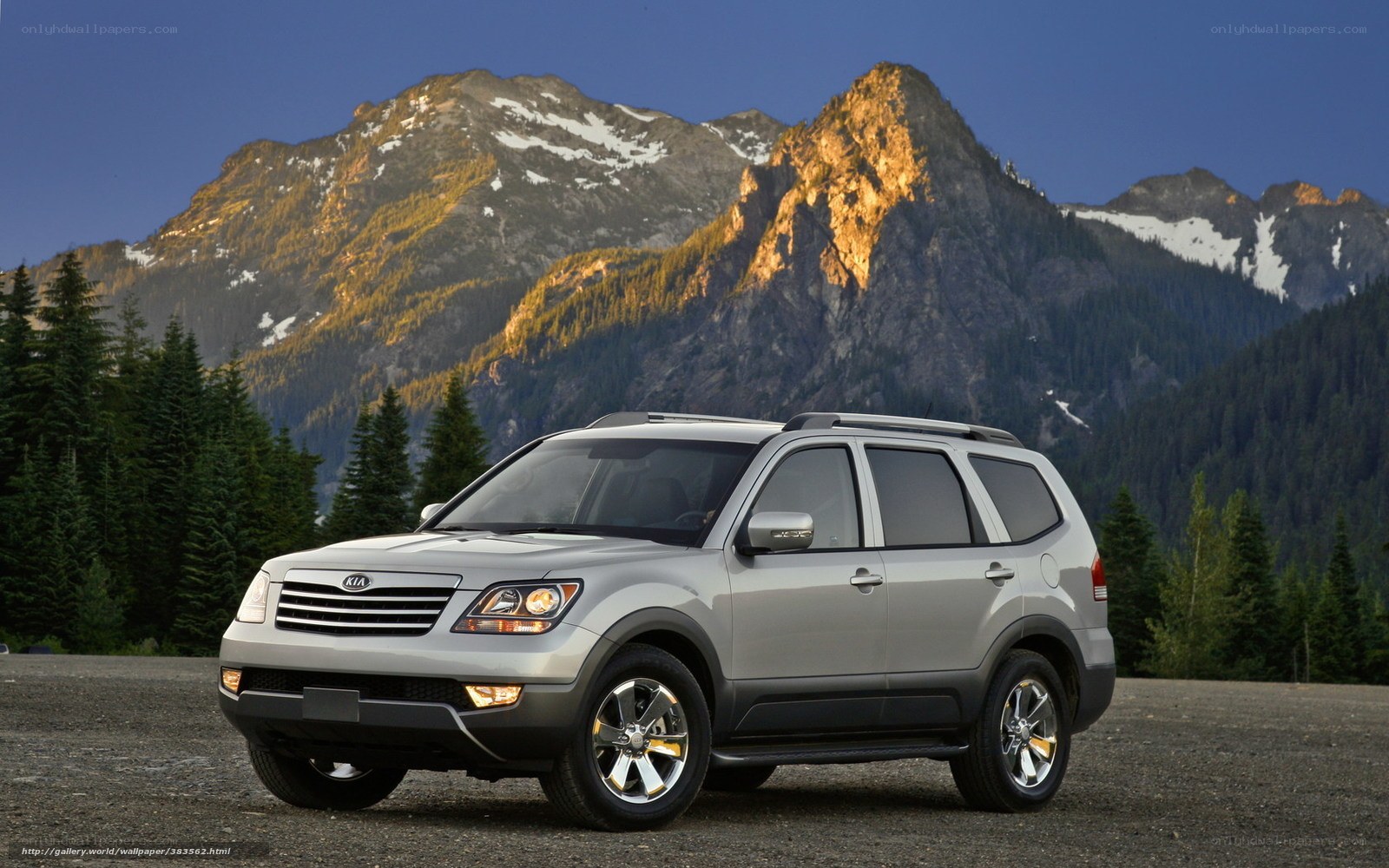 Silver SUV in mountain landscape