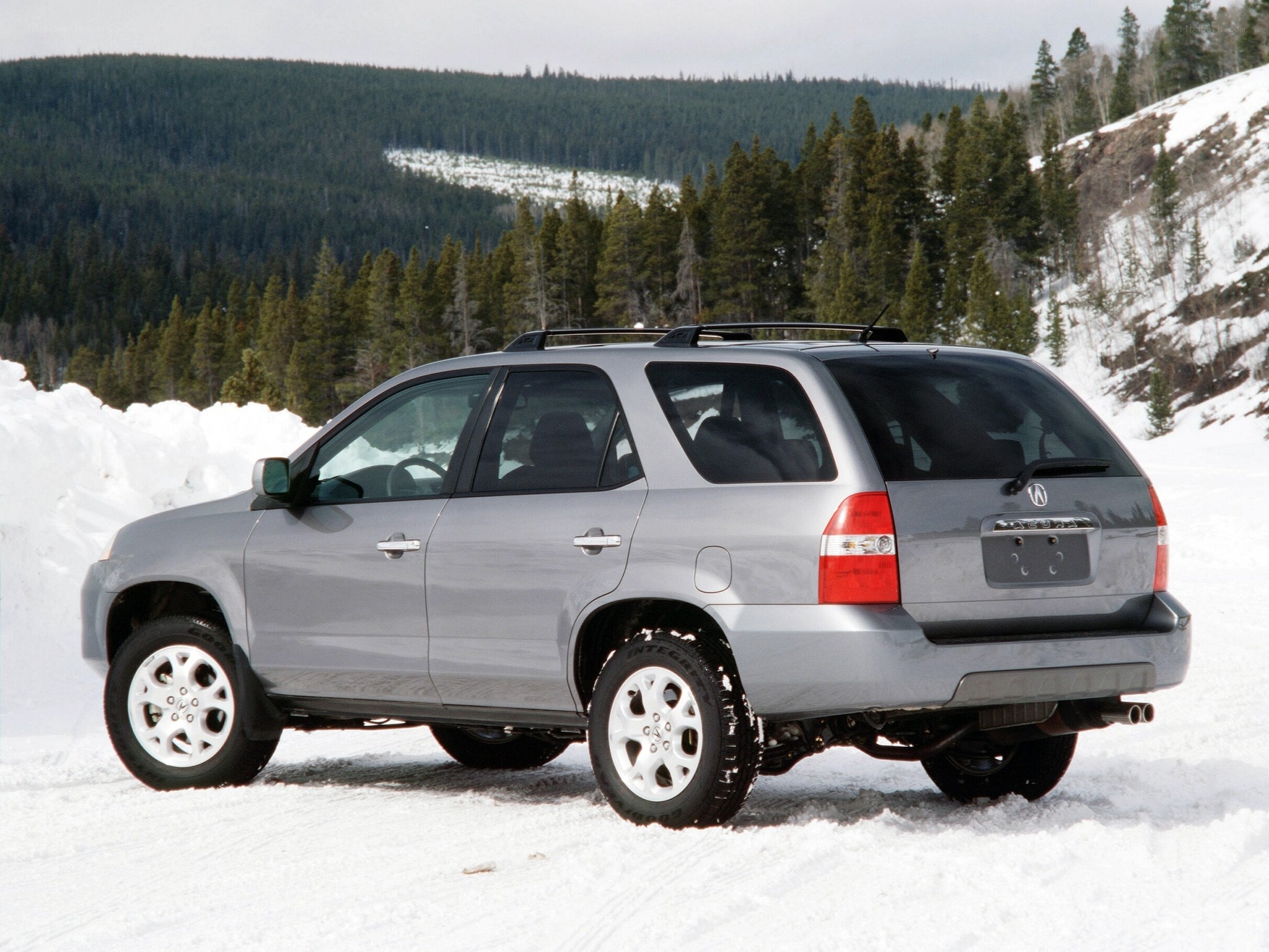 silver suv in snowy landscape