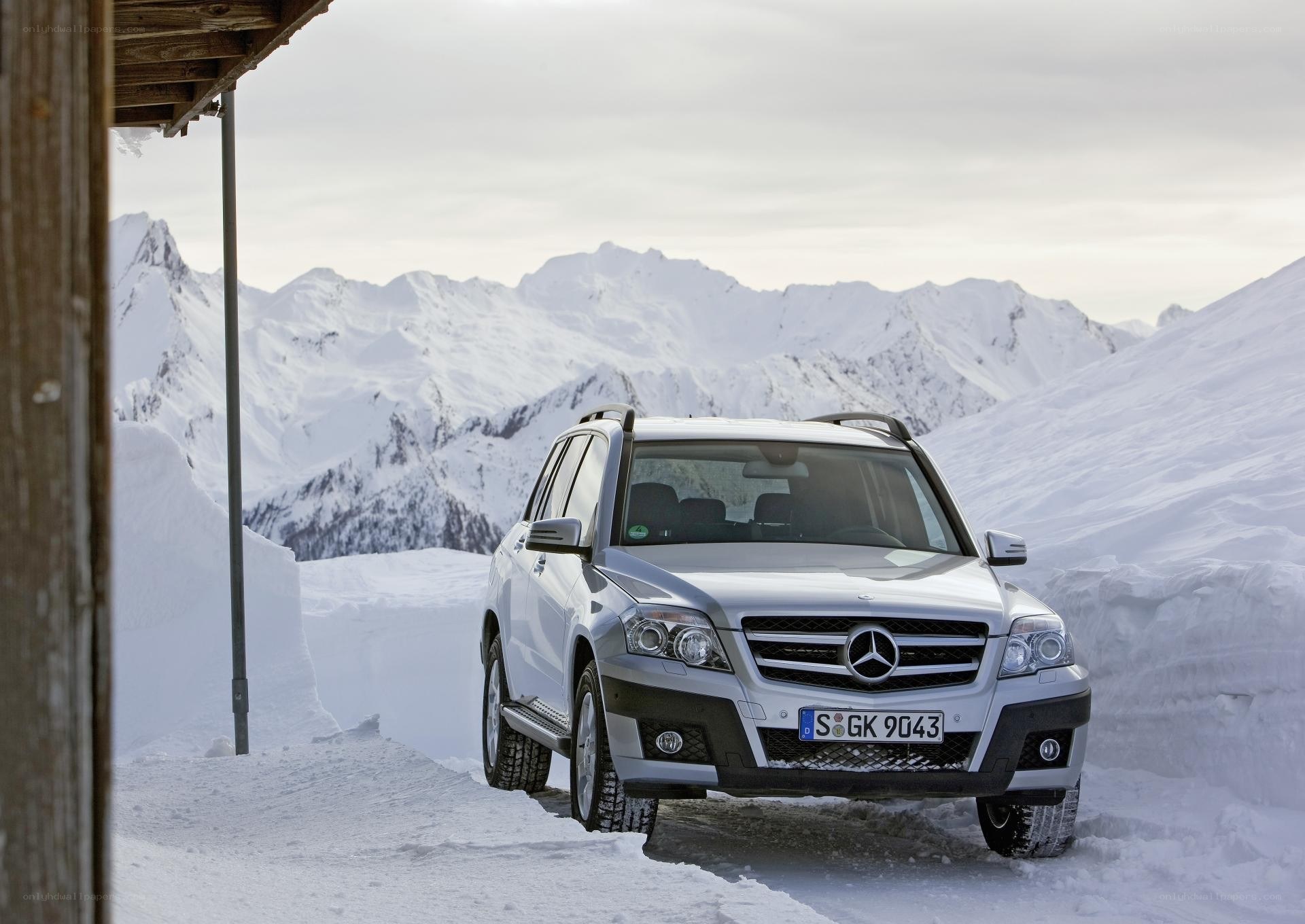 Silver SUV in snowy mountains