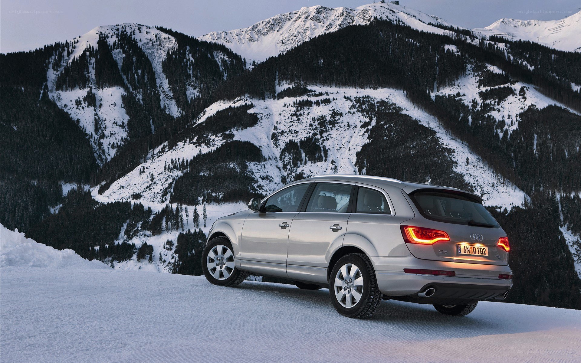 Silver SUV in snowy mountains