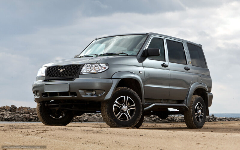 Silver SUV on a beach