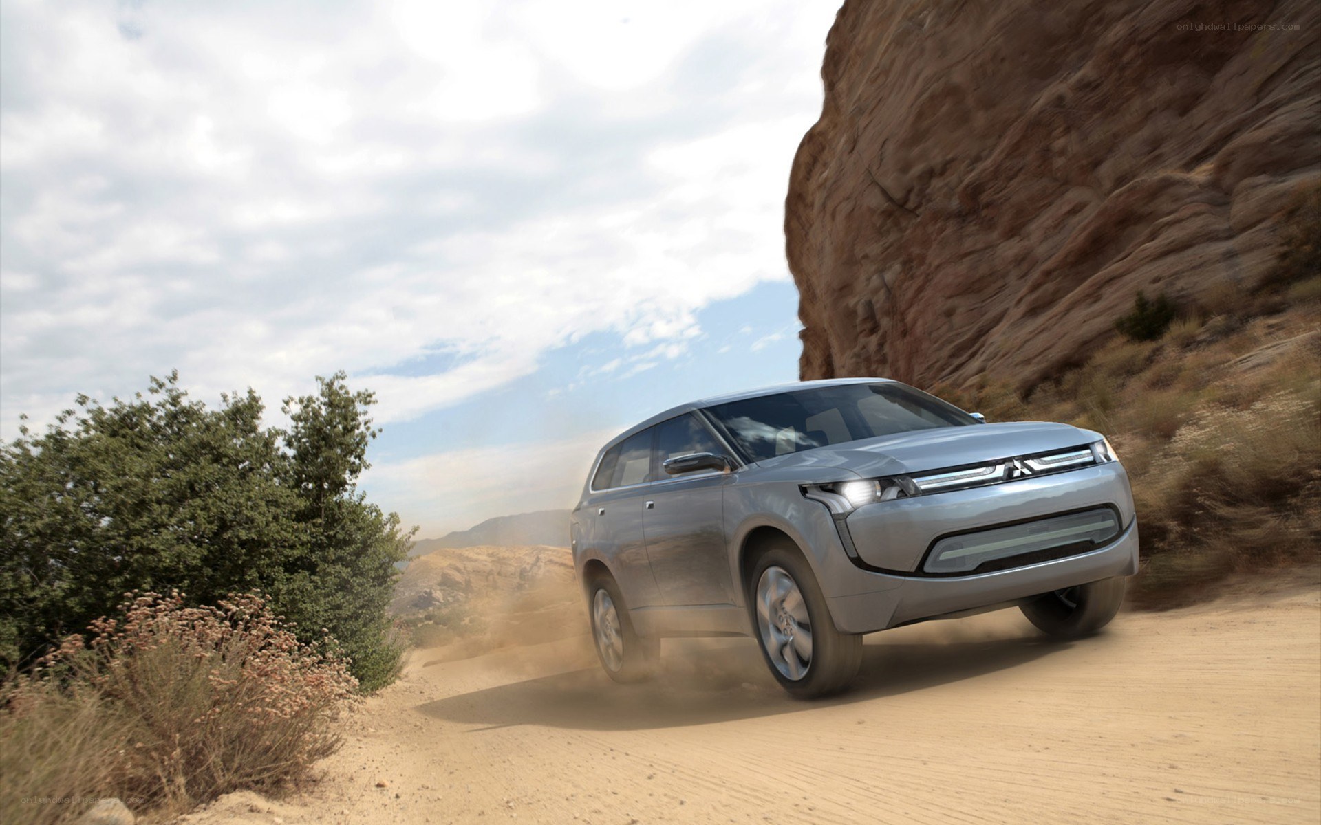 Silver SUV on a dirt road