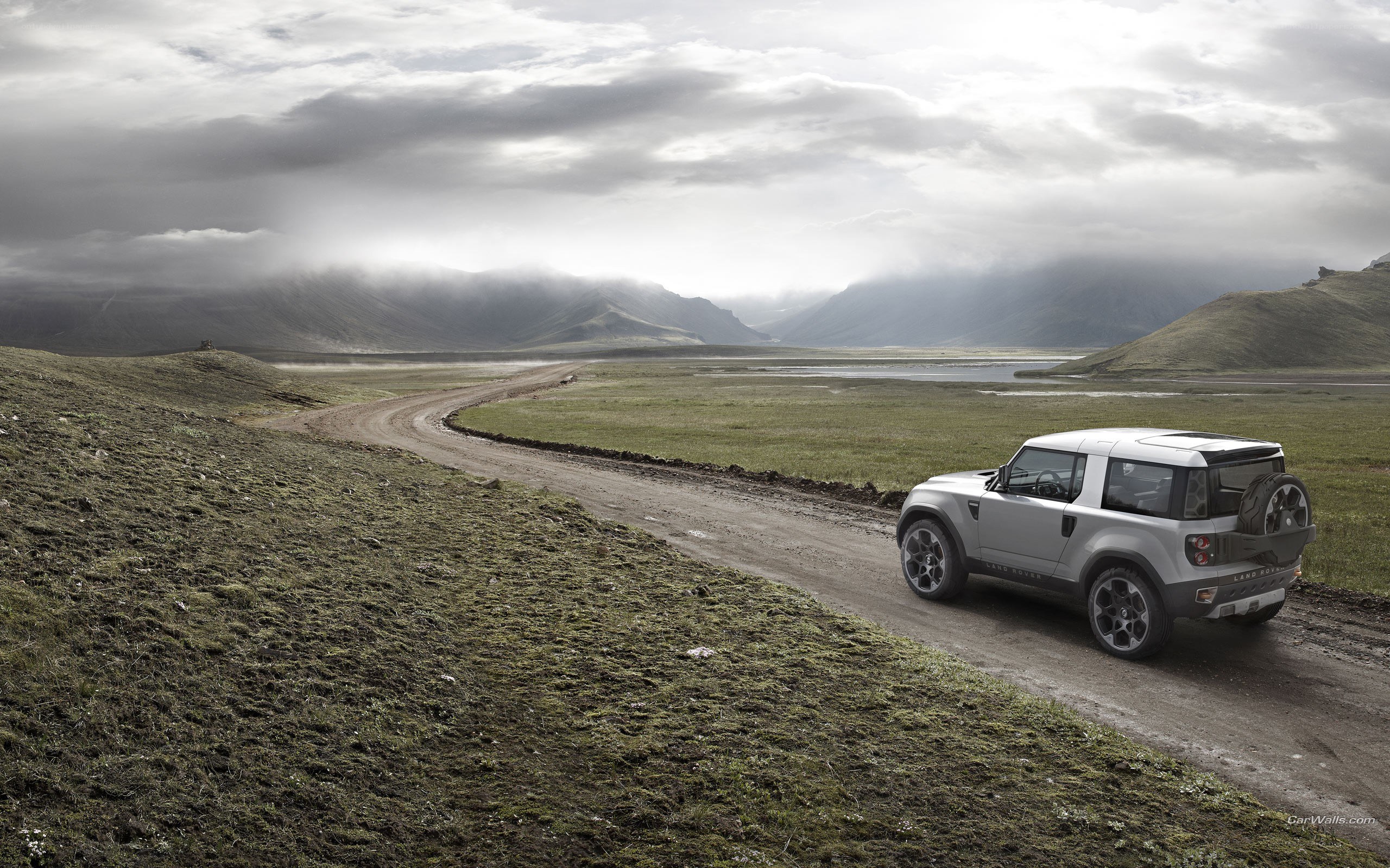Silver SUV on a dirt road