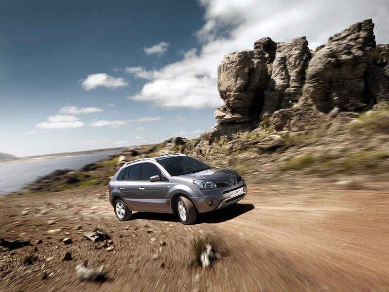 Silver SUV on a dirt road