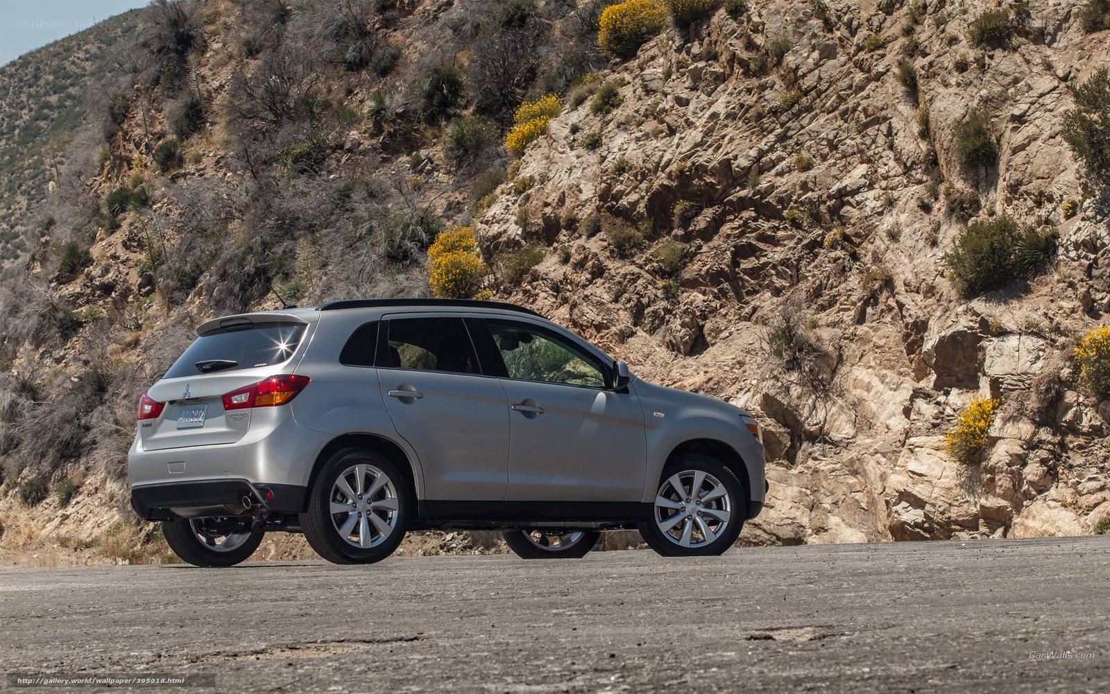 Silver SUV on a mountain road