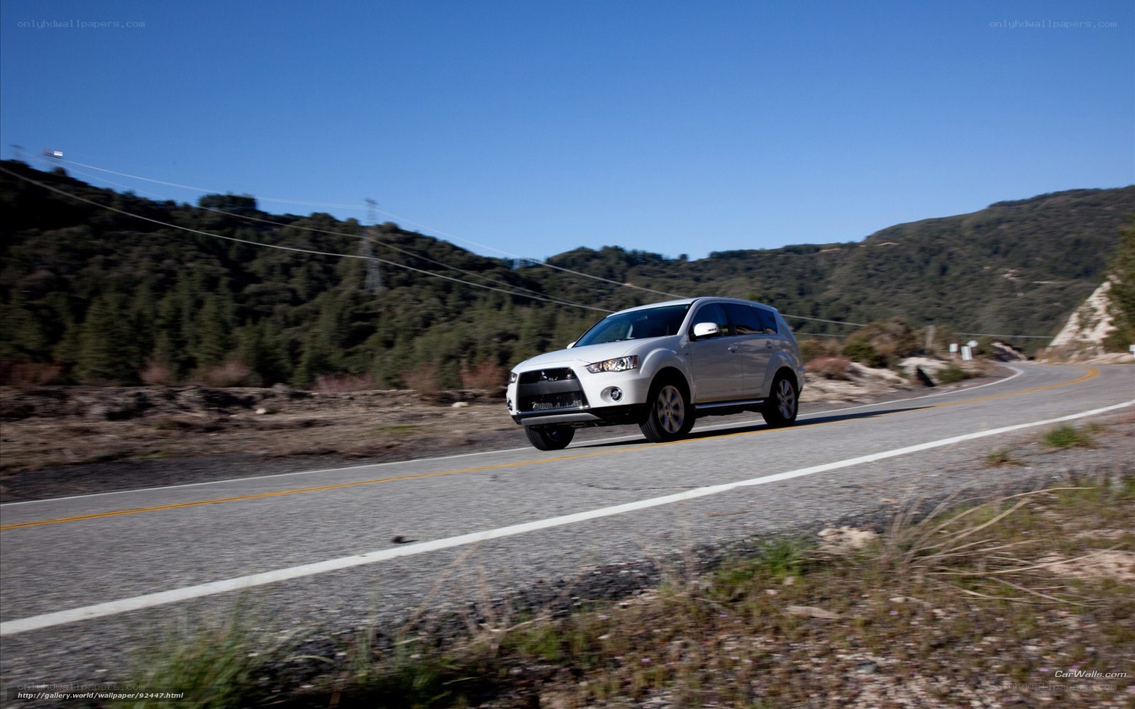 Silver SUV on a winding road