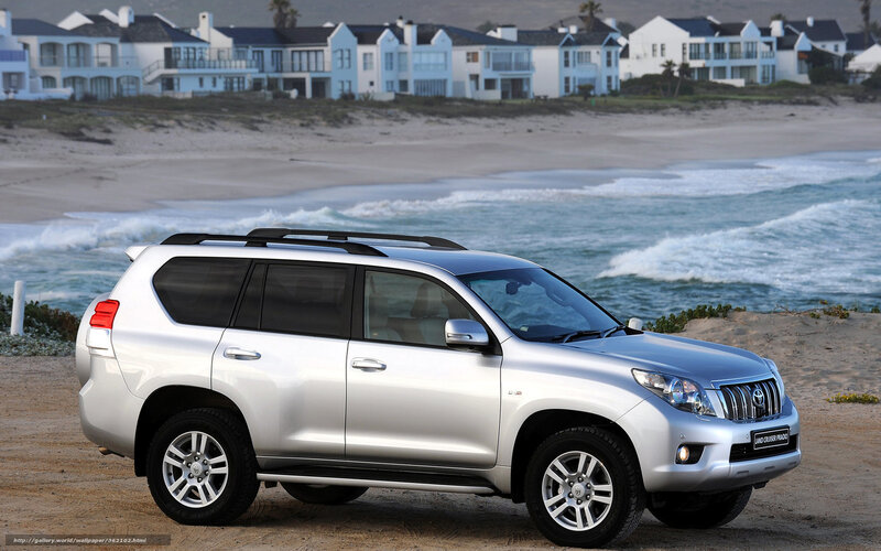 Silver SUV on beach