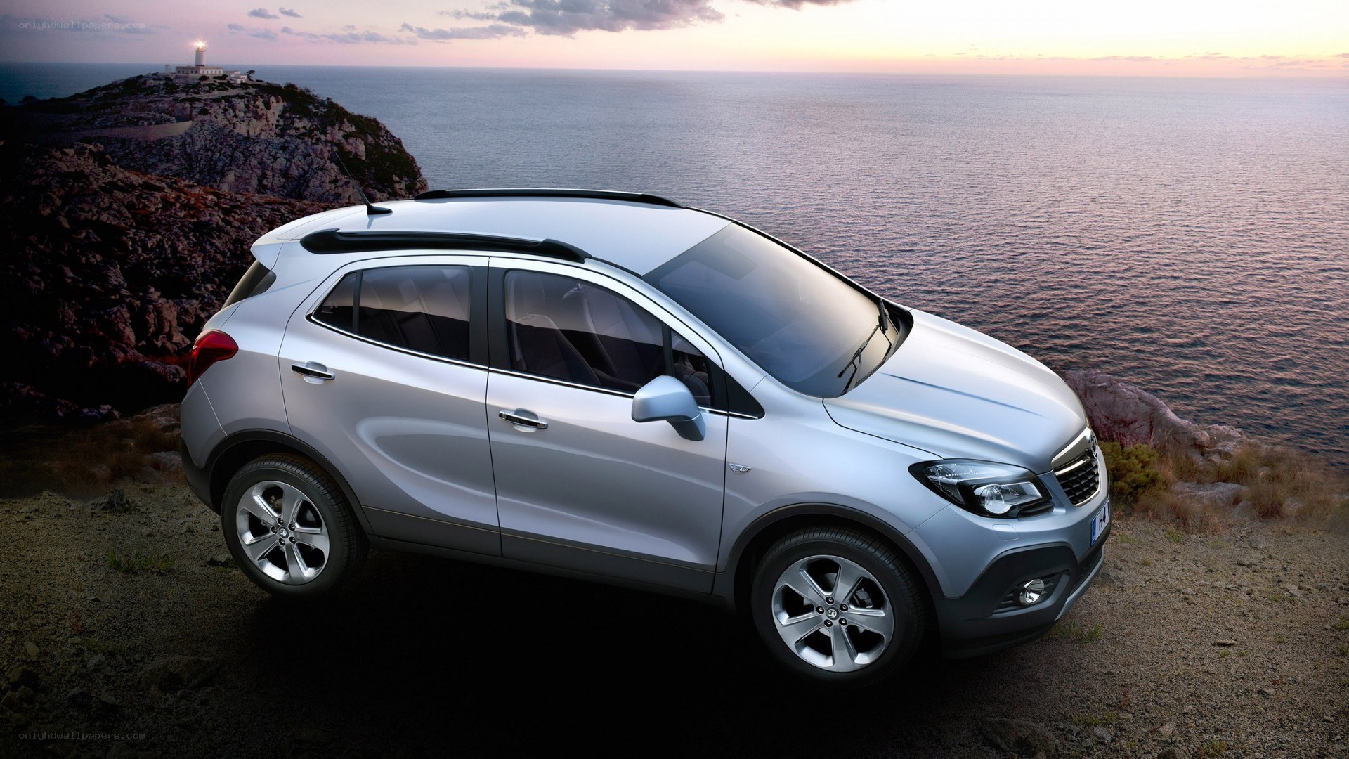Silver SUV on coastal cliff