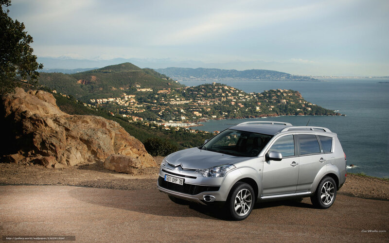 Silver SUV on coastal overlook