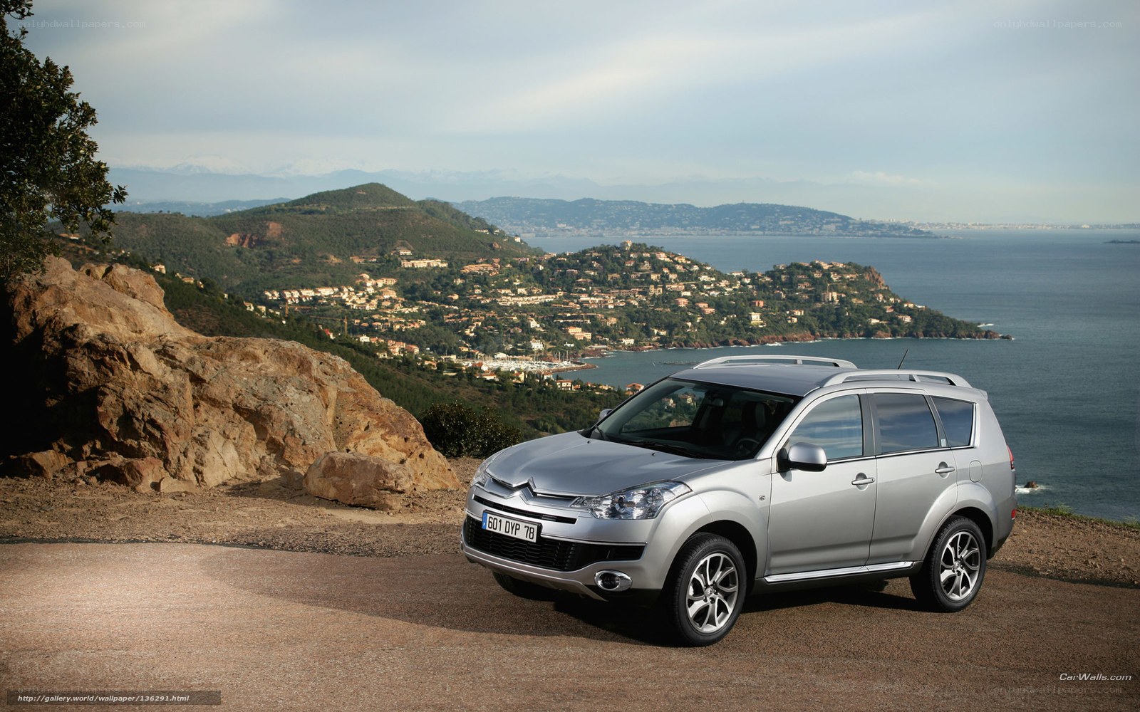 Silver SUV on coastal overlook