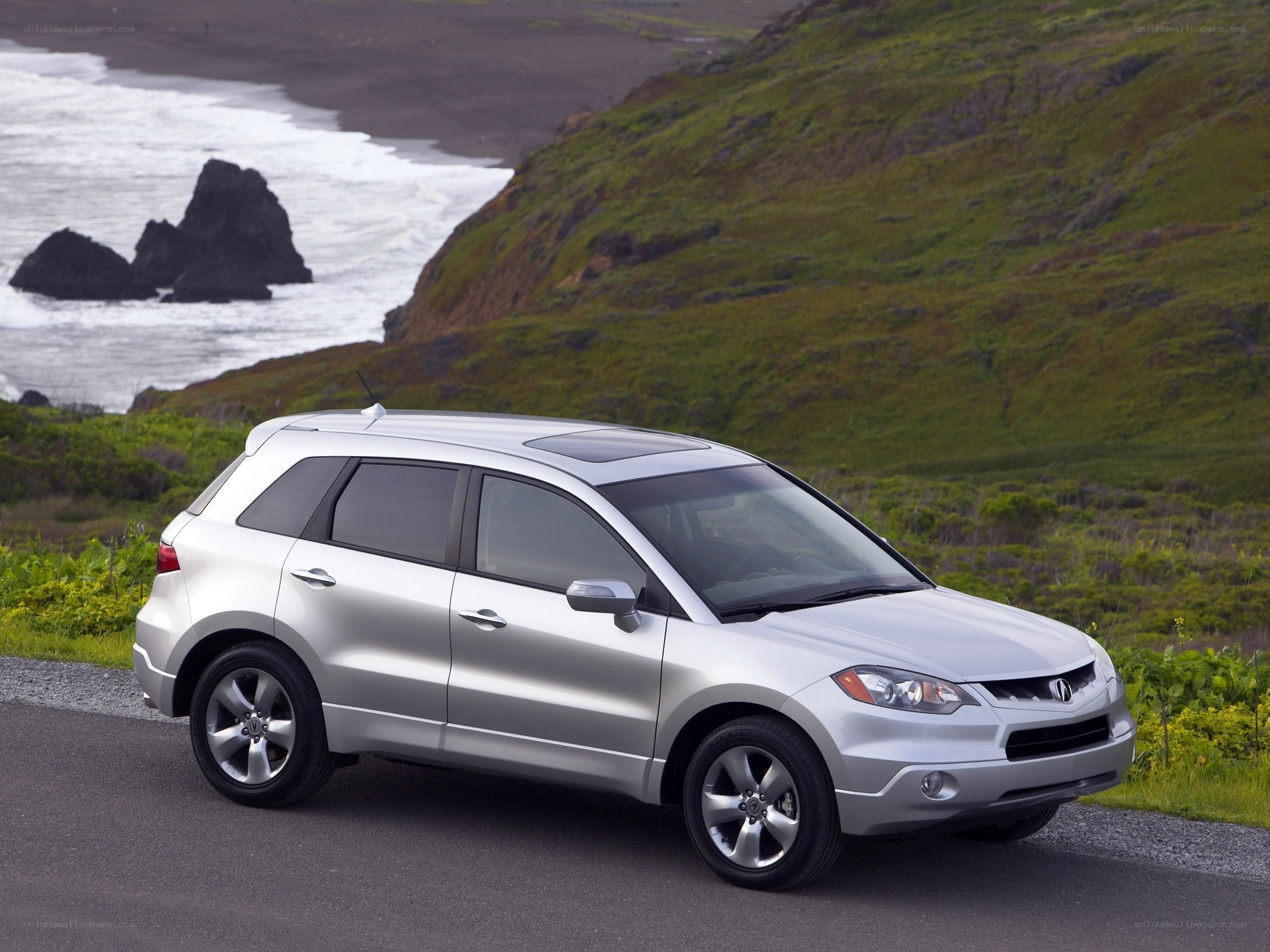Silver SUV on coastal road