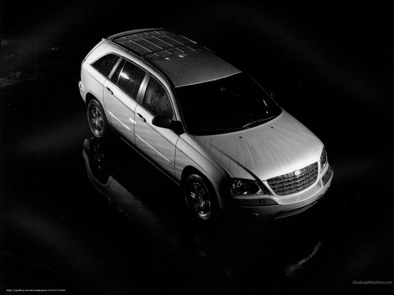 silver suv on dark surface