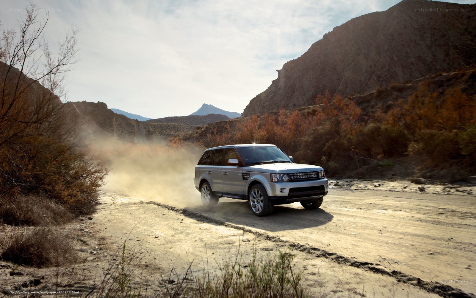 Silver SUV on dusty road