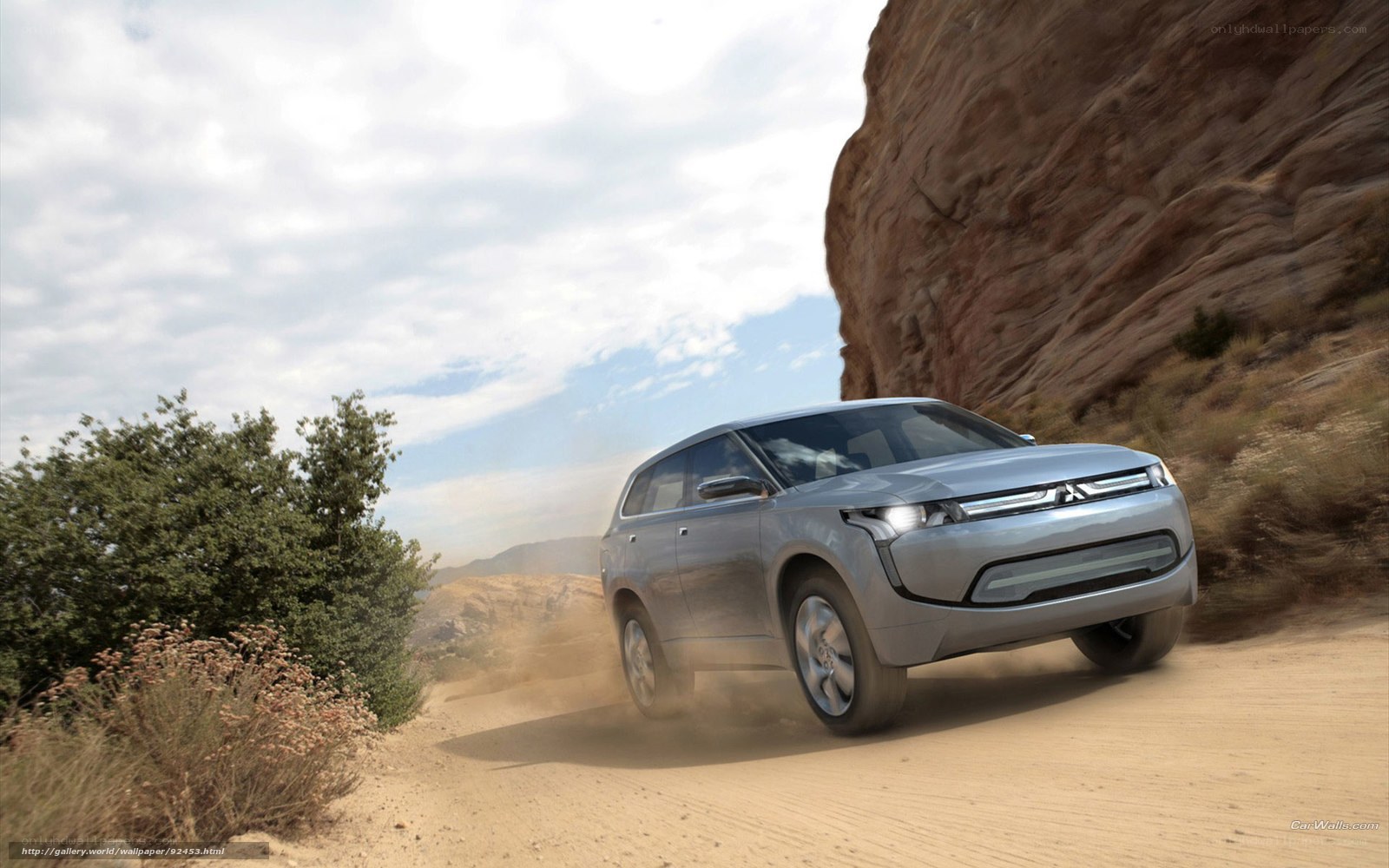 Silver SUV on dusty trail