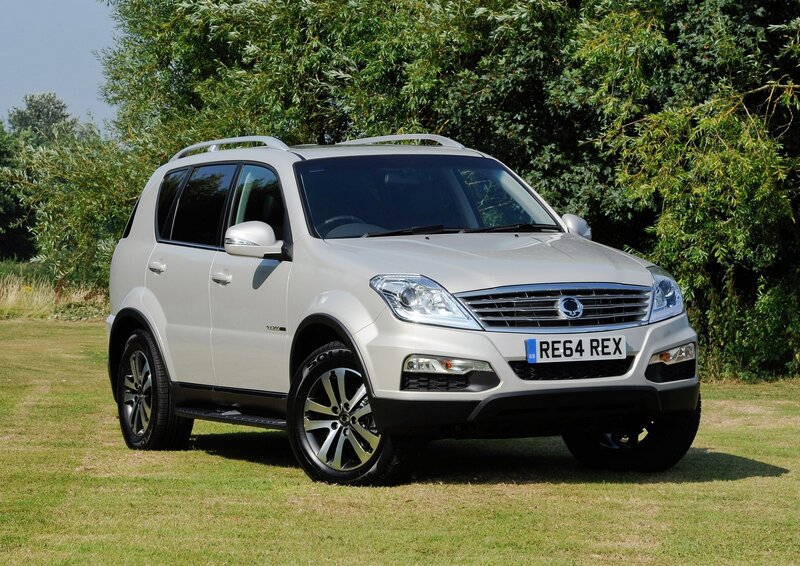 silver suv on grass