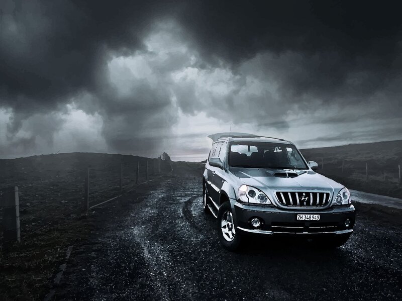 Silver Suv on Gravel Road