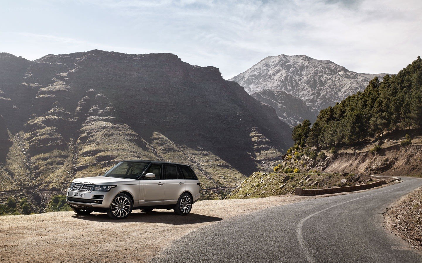 Silver SUV on mountain road