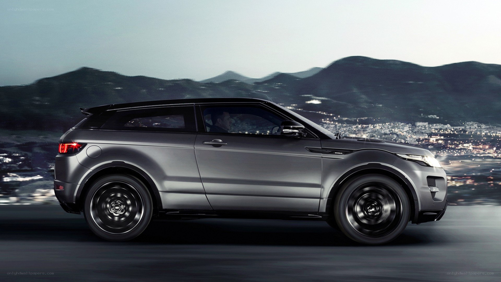 silver SUV on mountain road