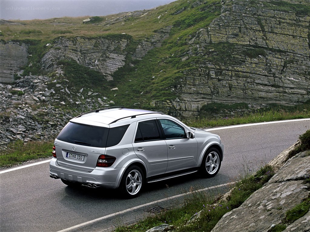 silver suv on mountain road