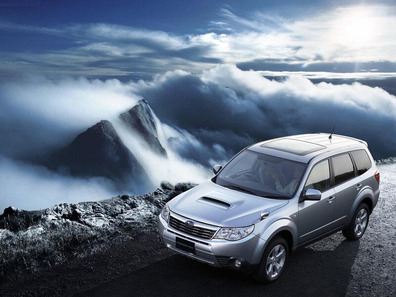 Silver SUV on mountain road