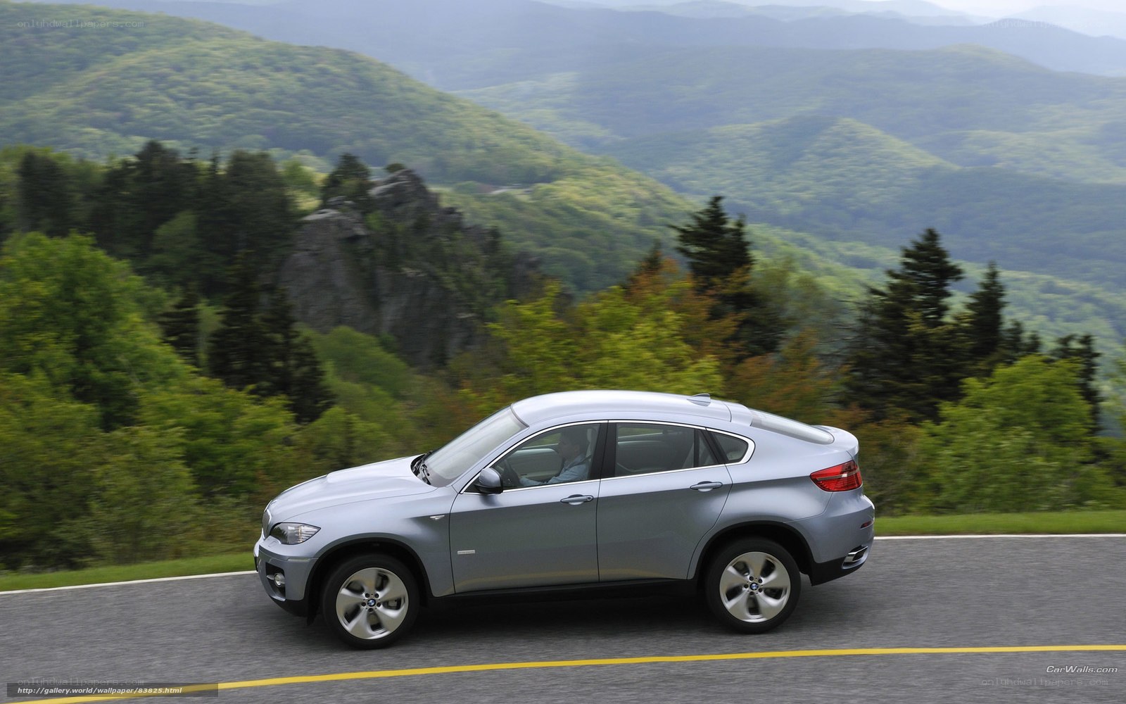 silver suv on mountain road