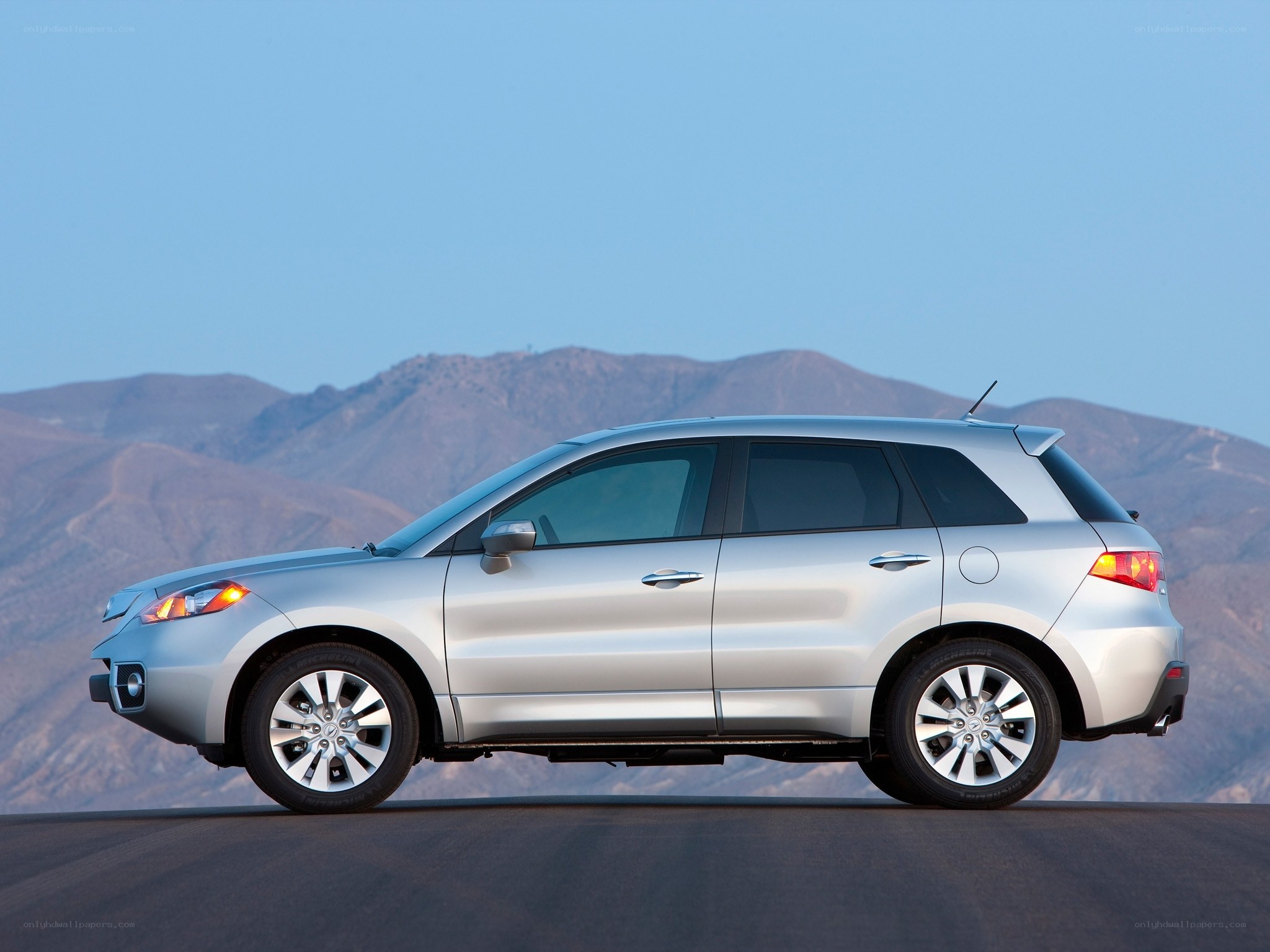 silver suv on mountain road